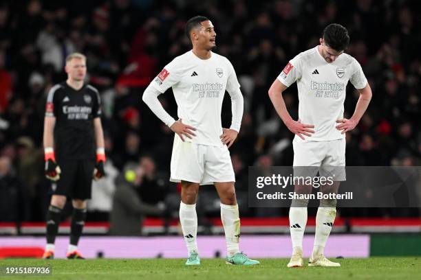 William Saliba and Declan Rice of Arsenal look dejected after the team's defeat in the Emirates FA Cup Third Round match between Arsenal and...