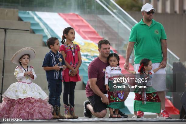 Children are showcasing traditional Mexican outfits as members of the Mexican diaspora celebrate Mexican Independence Day in Toronto, Ontario,...