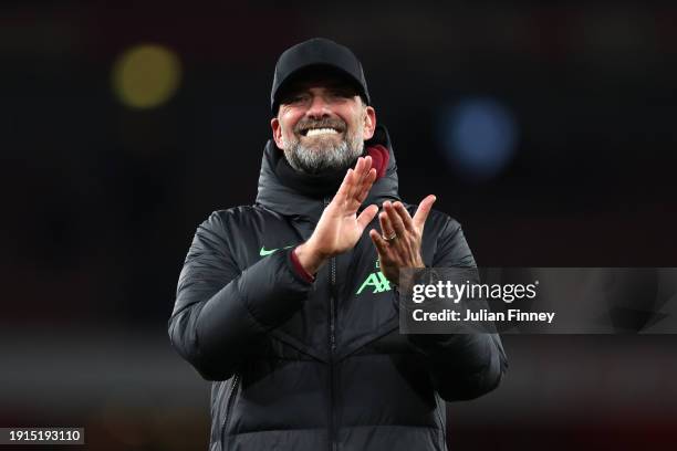 Juergen Klopp, Manager of Liverpool, applauds the fans after the team's victory in the Emirates FA Cup Third Round match between Arsenal and...