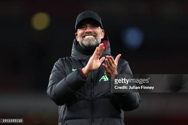 Juergen Klopp, Manager of Liverpool, applauds the fans after the team's victory in the Emirates FA Cup Third Round match between Arsenal and...
