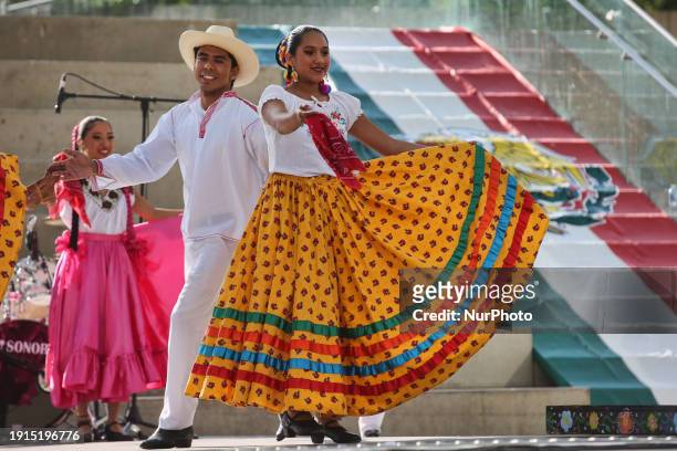 Mexican dancers are performing in traditional attire as members of the Mexican diaspora celebrate Mexican Independence Day in Toronto, Ontario,...