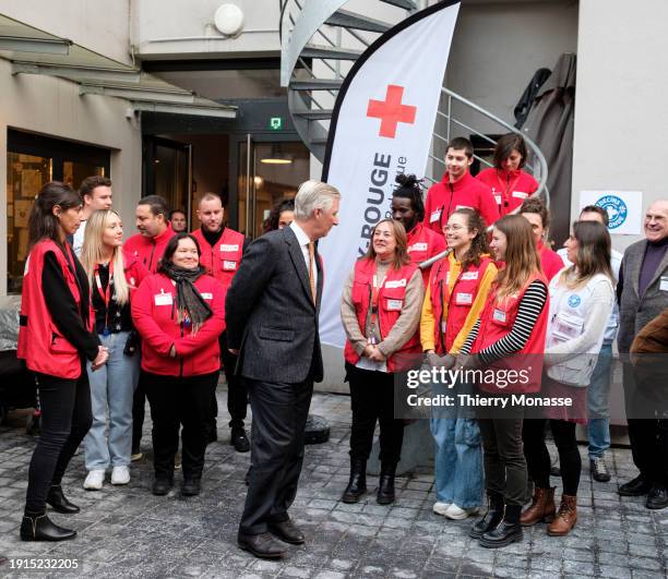 Belgium King Philippe is talking with the 'Red Cross' team during a visits of the "Train Hostel" center a winter reception system for homeless people...