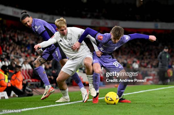 Conor Bradley of Liverpool competing with Emile Smith Rowe of Arsenalduring the Emirates FA Cup Third Round match between Arsenal and Liverpool at...