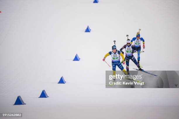 Linn Persson of Sweden, Jeanne Richard of France and Yuliia Dzhima of Ukraine in action competes during the Women 4x6km Relay at the BMW IBU World...