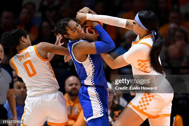 Ajae Petty of the Kentucky Wildcats, Jewel Spear and Tamari Key of the Tennessee Lady Vols wrestle for the ballin the third quarter at...