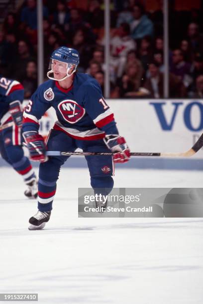 New York Islander's forward, Brian Mullen, skates up ice looking to receive the pass during the game against the NJ Devils at the Meadowlands Arena...