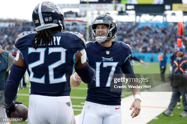 Derrick Henry celebrates with Ryan Tannehill of the Tennessee Titans after a touchdown during the second quarter against the Jacksonville Jaguars at...