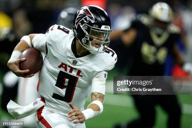 Desmond Ridder of the Atlanta Falcons scrambles in the first half in a game against the New Orleans Saints at Caesars Superdome on January 07, 2024...