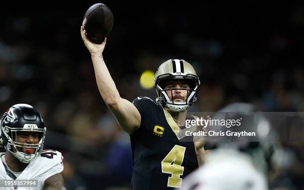 Derek Carr of the New Orleans Saints throws the ball under pressure in the first half during a game against the Atlanta Falcons at Caesars Superdome...