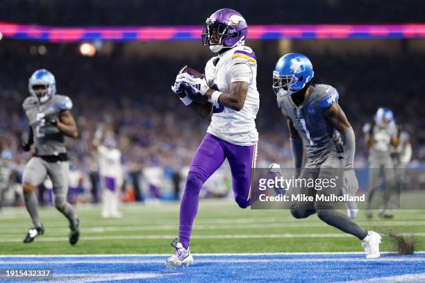 Jordan Addison of the Minnesota Vikings scores a touchdown during the fourth quarter in the game against the Detroit Lions at Ford Field on January...