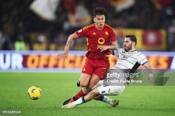 Paulo Dybala of AS Roma is tackled by Sead Kolasinac of Atalanta BC during the Serie A TIM match between AS Roma and Atalanta BC at Stadio Olimpico...