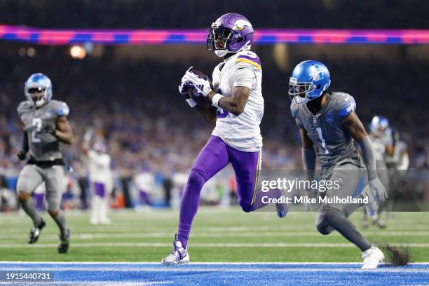Jordan Addison of the Minnesota Vikings scores a touchdown during the fourth quarter in the game against the Detroit Lions at Ford Field on January...
