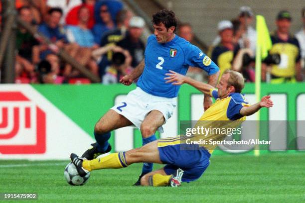 June 19: Circo Ferrara of Italy and Hakan Mild of Sweden challenge during the UEFA Euro 2000 Group B match between Italy and Sweden at Psv Stadium on...