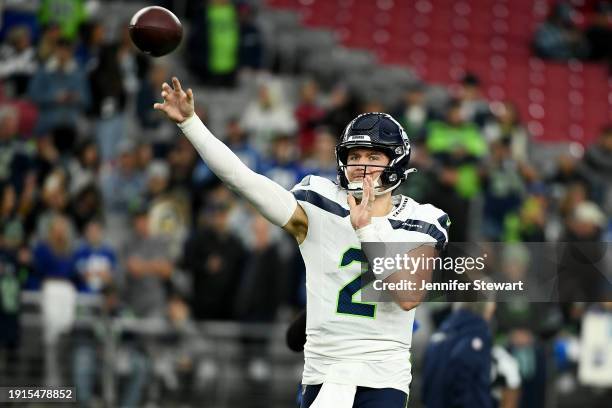 Drew Lock of the Seattle Seahawks warms up before the game against the Arizona Cardinals at State Farm Stadium on January 07, 2024 in Glendale,...