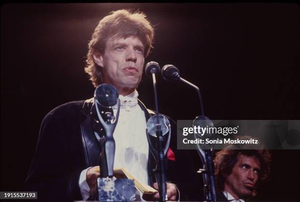 British Rock singer Mick Jagger, of the group the Rolling Stones, delivers an acceptance speech following the group's induction into the Rock and...