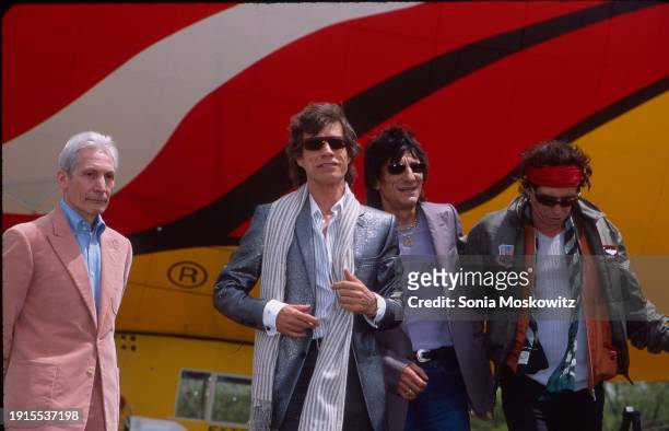 View of, from left, British Rock musicians Charlie Watts , Mick Jagger, Ron Wood, and Keith Richards, all of the band the Rolling Stones, as they...