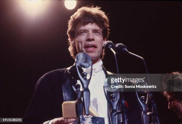 British Rock singer Mick Jagger, of the group the Rolling Stones, delivers an acceptance speech following the group's induction into the Rock and...