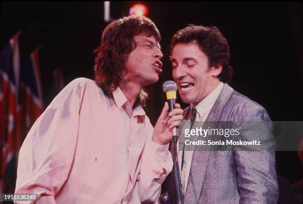 View of singer Mick Jagger and musician Bruce Springsteen as they perform during the Rock and Roll Hall of Fame Awards ceremony at the Waldorf...