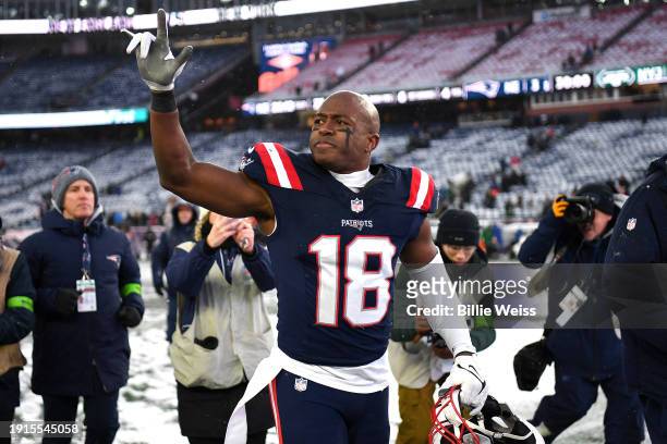 Matthew Slater of the New England Patriots waves to fans while walking off the field after a game against the New York Jets at Gillette Stadium on...
