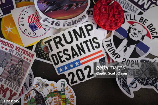 Campaign stickers sit on a table at Club 45, the Winneshiek County Republican Party headquarters, before a visit by Republican presidential candidate...