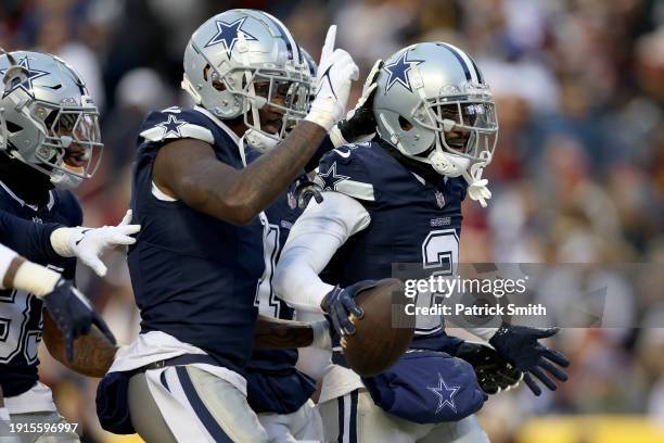 Jourdan Lewis of the Dallas Cowboys reacts to recovering a fumble during the first half against the Washington Commanders at FedExField on January...