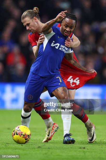 Raheem Sterling of Chelsea is challenged by Brad Potts of Preston North End during the Emirates FA Cup Third Round match between Chelsea and Preston...