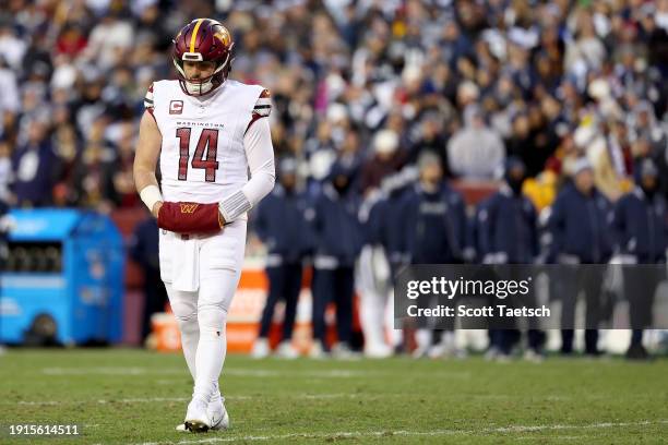 Sam Howell of the Washington Commanders looks on during the first quarter against the Dallas Cowboys at FedExField on January 07, 2024 in Landover,...