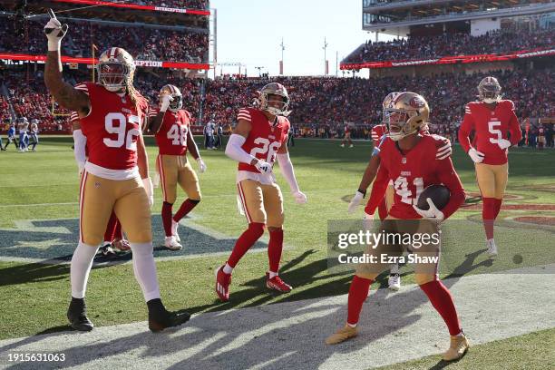 Tayler Hawkins of the San Francisco 49ers celebrates with teammates after an interception at Levi's Stadium on January 07, 2024 in Santa Clara,...