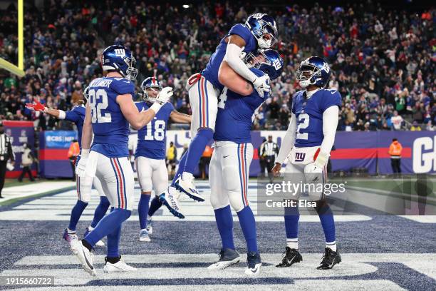 Darius Slayton of the New York Giants celebrates after a touchdown with Mark Glowinski during the second quarter in the game against the Philadelphia...