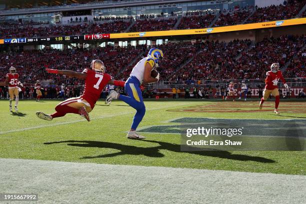 Puka Nacua of the Los Angeles Rams catches a touchdown against Charvarius Ward of the San Francisco 49ers in the first quarter during a game at...