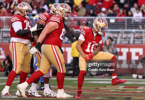 Ronnie Bell of the San Francisco 49ers celebrates with teammates after a touchdown reception in the second quarter during a game against the Los...