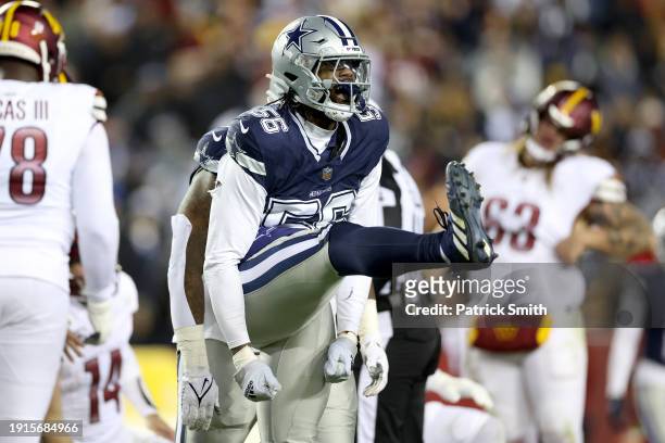 Dante Fowler Jr. #56 of the Dallas Cowboys reacts after a sack during the second quarter against the Washington Commanders at FedExField on January...