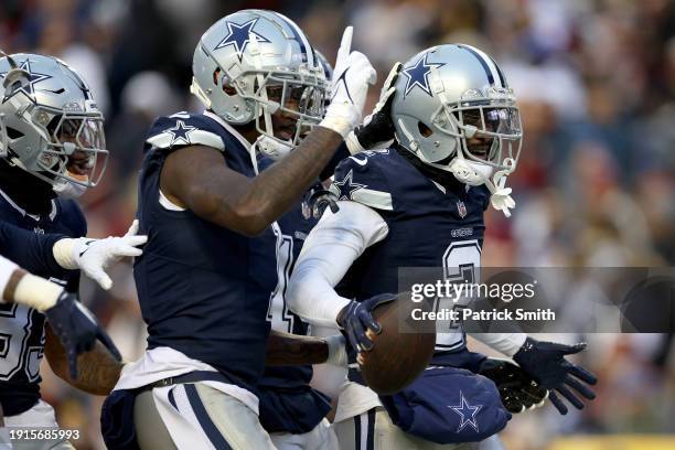 Jourdan Lewis of the Dallas Cowboys reacts to recovering a fumble during the first half against the Washington Commanders at FedExField on January...