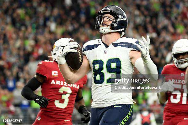 Will Dissly of the Seattle Seahawks celebrates during the second quarter against the Arizona Cardinals at State Farm Stadium on January 07, 2024 in...