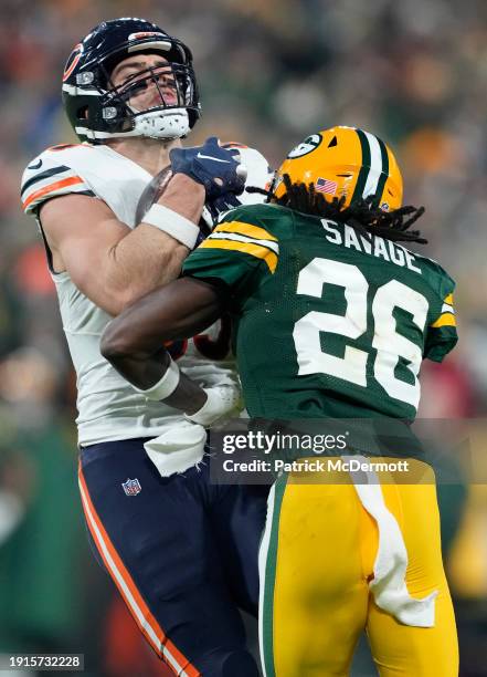 Cole Kmet of the Chicago Bears is tackled by Darnell Savage of the Green Bay Packers during the third quarter at Lambeau Field on January 07, 2024 in...