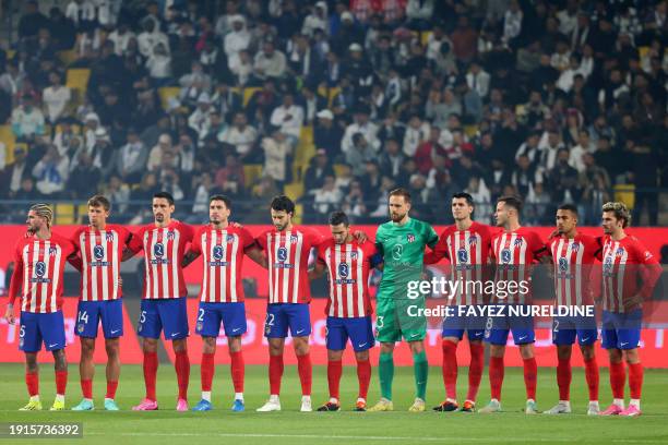 Atletico Madrid's players observe a moment of silence in honour of late German football legend Franz Beckenbauer ahead of the Spanish Super Cup...