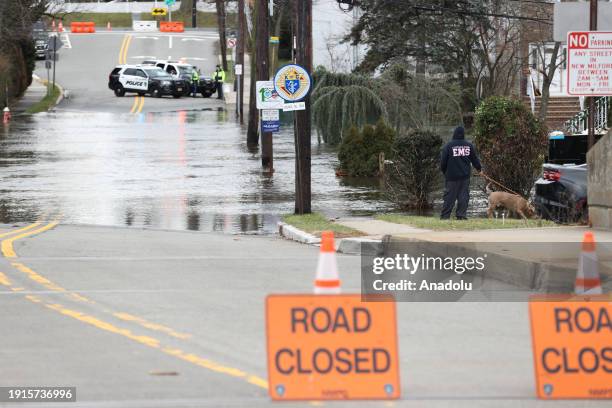 Police close roads in a residential area where the Hackensack River overflowed its borders and floods houses in New Milford, New Jersey, United...