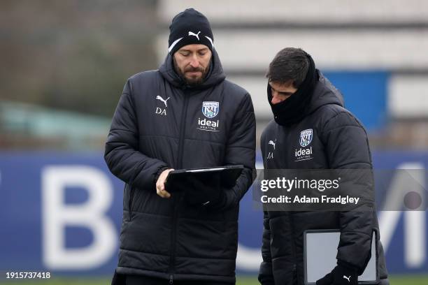 Damia Abella Statistical Analyst of West Bromwich Albion and Jorge Alarcon coach of West Bromwich Albion in discussion during a first team training...