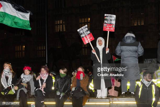 Pro-Palestinian protesters gather outside Houses of Parliament to demonstrate against the anti-boycott bill on its third reading that if passed by...