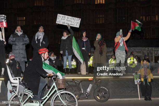 Pro-Palestinian protesters gather outside Houses of Parliament to demonstrate against the anti-boycott bill on its third reading that if passed by...