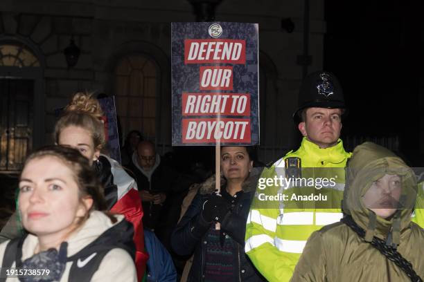 Pro-Palestinian protesters gather outside Houses of Parliament to demonstrate against the anti-boycott bill on its third reading that if passed by...