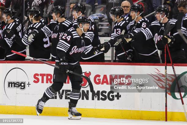 New Jersey Devils defenseman Colin Miller celebrates after scoring a goal during a game between the Vancouver Canucks and New Jersey Devils on...