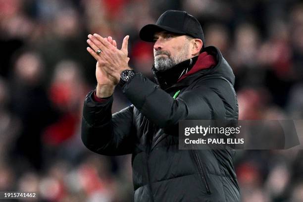 Liverpool's German manager Jurgen Klopp applauds the fans following the English League Cup semi-final first leg football match between Liverpool and...