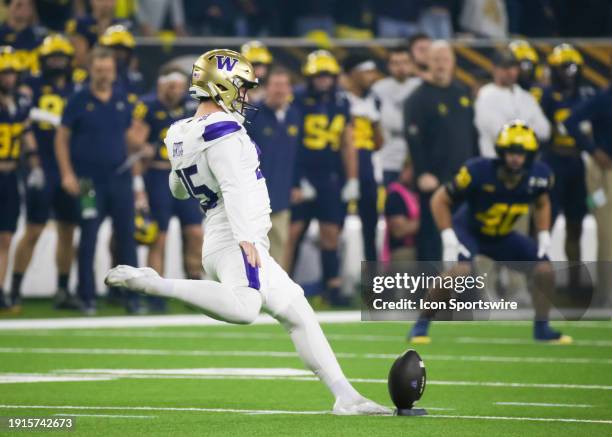 Washington Huskies place kicker Grady Gross kicks off the ball in the first quarter during the CFP National Championship game between the Michigan...