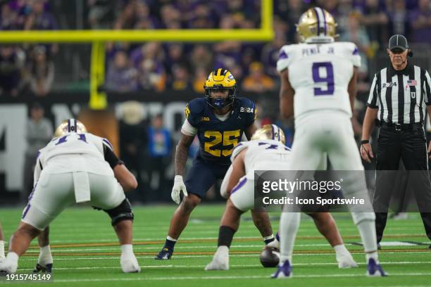 Michigan Wolverines linebacker Junior Colson gets ready for a play during the CFP National Championship game between the Michigan Wolverines and...