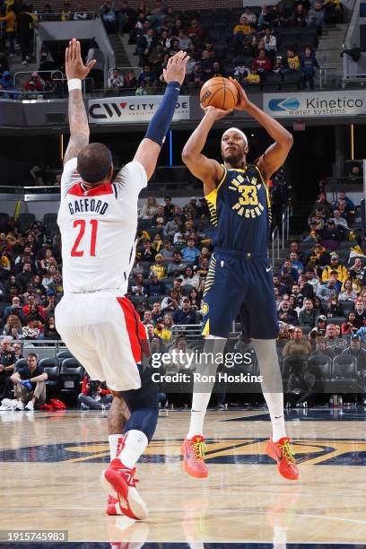 Myles Turner of the Indiana Pacers shoots a three point basket during the game against the Washington Wizards on January 10, 2024 at Gainbridge...