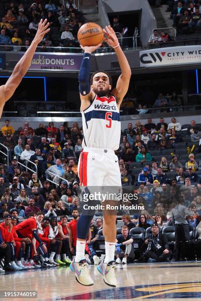 Tyus Jones of the Washington Wizards shoots a three point basket during the game against the Indiana Pacers on January 10, 2024 at Gainbridge...