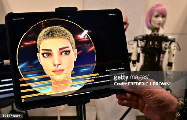 Person has a conversation with a Humanoid Robot from AI Life, on display at the Consumer Electronics Show in Las Vegas, Nevada on January 10, 2024.