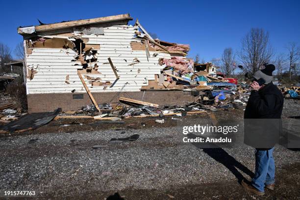 View of the destroyed house due to the strong storms as storm clouds are seen behind as devastating storm caused widespread damage with a possible...