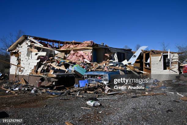 View of the destroyed house due to the strong storms as storm clouds are seen behind as devastating storm caused widespread damage with a possible...